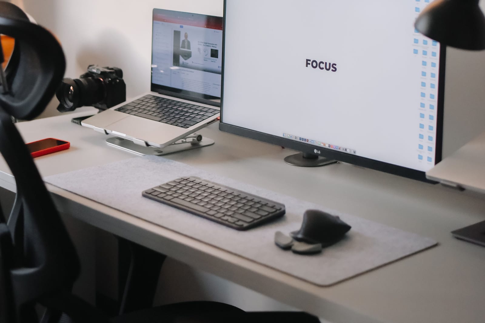 An organized desk with a monitor and computer accessories