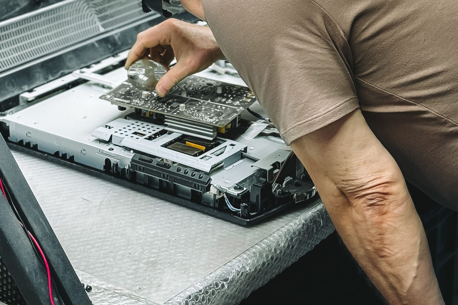 Technician checking computer hardware components