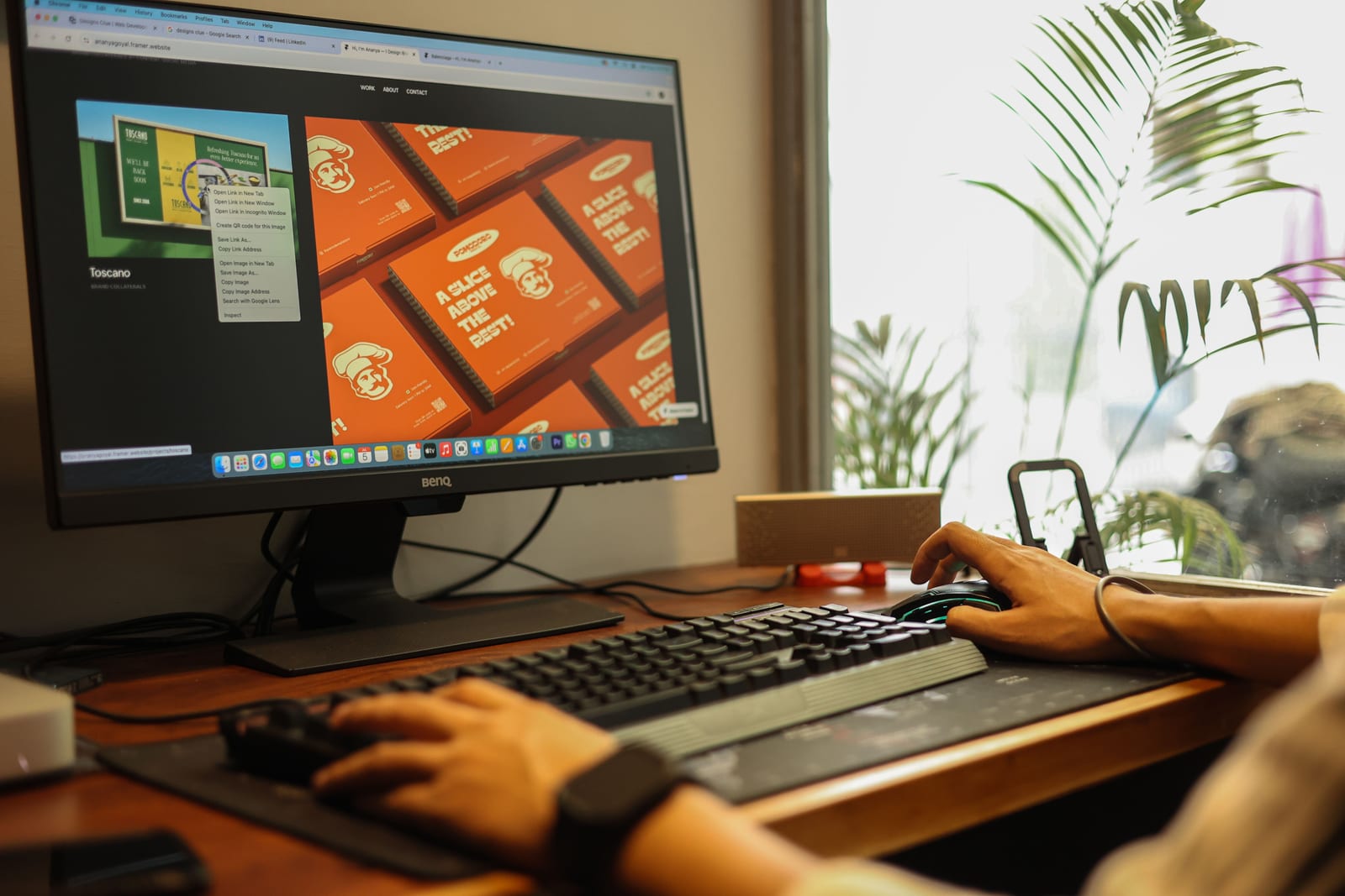 Computer monitor and work tools in a professional workspace